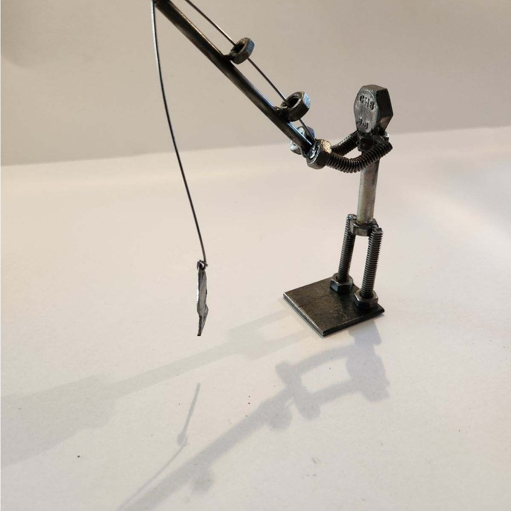 Metal at art man fishing  4x6x2  weighs 1lb